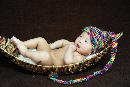 Baby lying in a boat. Stock Photo - Budget Royalty-Free & Subscription, Code: 400-07510539
