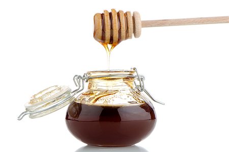 simsearch:400-05135233,k - Jar of honey with wooden drizzler isolated on white background Foto de stock - Super Valor sin royalties y Suscripción, Código: 400-07511087