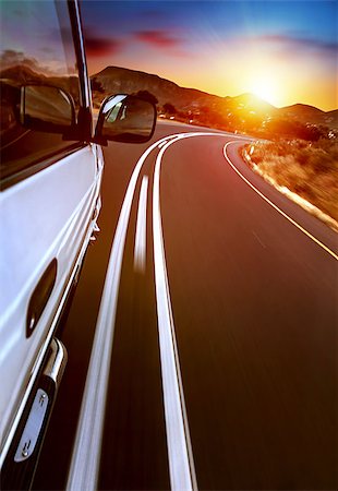 Road trip, car on the highway, road trip on sunset, journey and freedom travel, slow motion photo Stock Photo - Budget Royalty-Free & Subscription, Code: 400-07511631