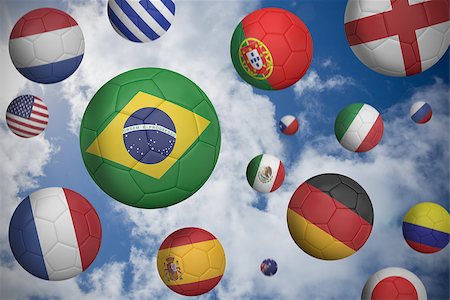 Footballs in various flag colours  against blue cloudy sky Stock Photo - Budget Royalty-Free & Subscription, Code: 400-07528627