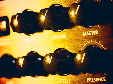 guitar amplifier panel in yellow light, closeup Stock Photo - Budget Royalty-Free & Subscription, Code: 400-07556925