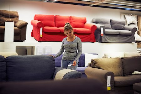 young hispanic woman shopping for furniture, sofa and home decor in store Stock Photo - Budget Royalty-Free & Subscription, Code: 400-07552810