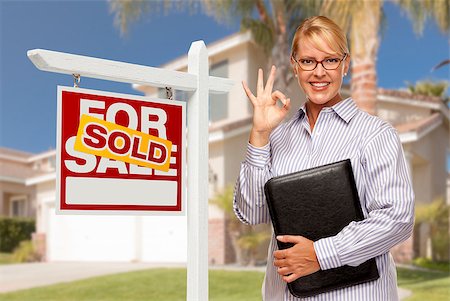simsearch:693-03308239,k - Attractive Female Real Estate Agent in Front of Sold Home For Sale Sign and House. Stock Photo - Budget Royalty-Free & Subscription, Code: 400-07553591