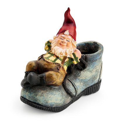 red dwarf - Gnome sitting on a boot isolated with clipping path Stock Photo - Budget Royalty-Free & Subscription, Code: 400-07568421