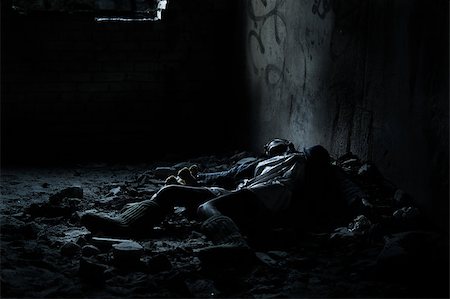 suicide - Dead woman lying on the dirty floor in a heap of rubbish in the basement Stock Photo - Budget Royalty-Free & Subscription, Code: 400-07569071