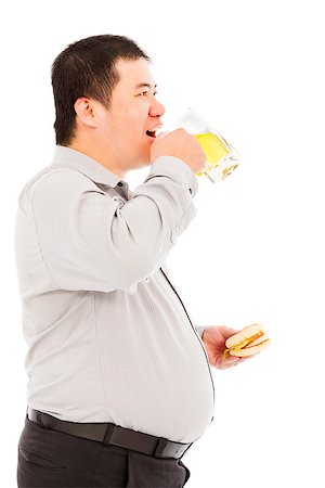 simsearch:400-06915547,k - fat business man drinking beer mug and eating hamburger Foto de stock - Super Valor sin royalties y Suscripción, Código: 400-07575408