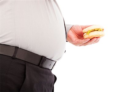 simsearch:400-06915547,k - fat business man holding a hamburger fastfood Foto de stock - Super Valor sin royalties y Suscripción, Código: 400-07575400