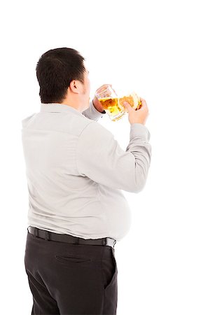 simsearch:400-06915547,k - fat business man is overeating. isolated on a white background Foto de stock - Super Valor sin royalties y Suscripción, Código: 400-07575410