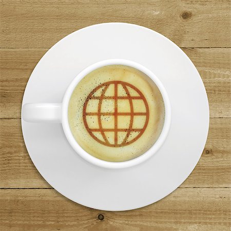Cup of coffee standing on a wooden surface. Picture of the globe in the coffee crema. top view Stock Photo - Budget Royalty-Free & Subscription, Code: 400-07576092