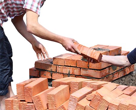 Workers laid red bricks. Close-up. Isolated on white background. Stock Photo - Budget Royalty-Free & Subscription, Code: 400-07576544