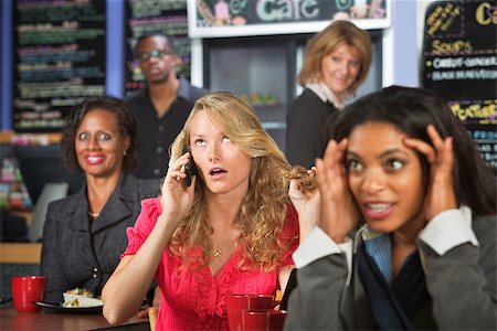 simsearch:400-04099373,k - Loud blond woman on cell phone in restaurant Stock Photo - Budget Royalty-Free & Subscription, Code: 400-07577390