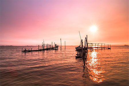 simsearch:400-04756224,k - Old fishing dock sunrise and calm water reflection. Stock Photo - Budget Royalty-Free & Subscription, Code: 400-07570219