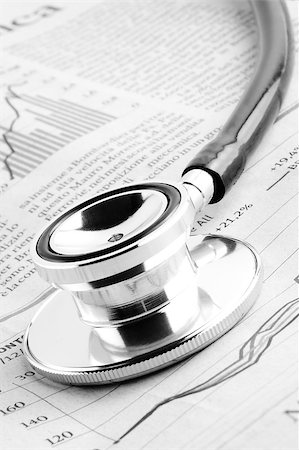 portfolio - detail of a stethoscope on financial chart Stock Photo - Budget Royalty-Free & Subscription, Code: 400-07571176