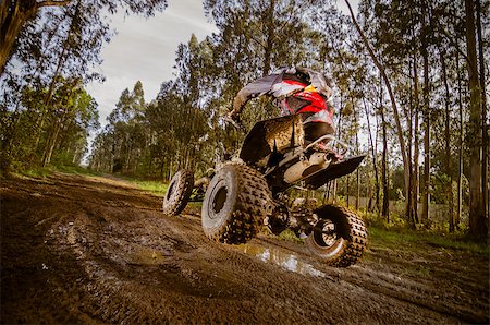 Quad rider jumping on a muddy forest trail. Stock Photo - Budget Royalty-Free & Subscription, Code: 400-07573887