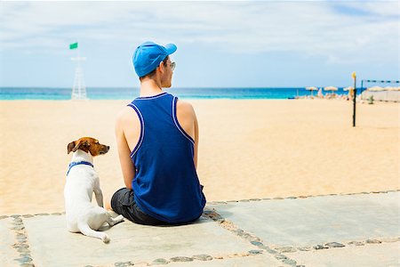 dog with owner looking at the beach Stock Photo - Budget Royalty-Free & Subscription, Code: 400-07580390