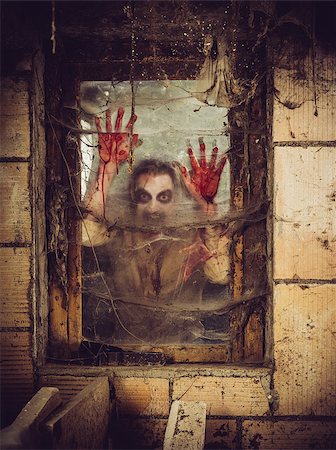 simsearch:700-00262810,k - Photo of a zombie outside a window that is covered with blood, spiderwebs and filth. Stock Photo - Budget Royalty-Free & Subscription, Code: 400-07580809