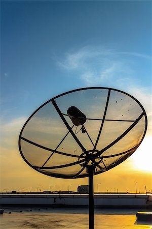 radar parabolic antenna - Satellite dish in the sunset on construction building. Stock Photo - Budget Royalty-Free & Subscription, Code: 400-07616830