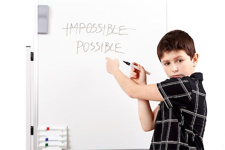 pupil in a empty classroom - young boy student in a classroom writing possible on a empty whiteboard Stock Photo - Budget Royalty-Free & Subscription, Code: 400-07616879