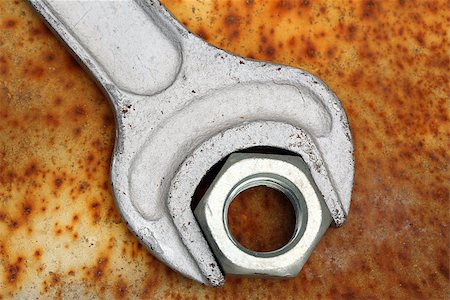 pipe wrench - wrench and nut close up on rusty grunge Stock Photo - Budget Royalty-Free & Subscription, Code: 400-07617207
