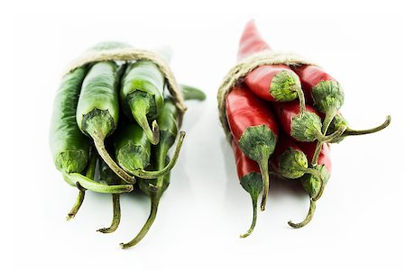 simsearch:628-02228100,k - Two sets of red and green hot chili pepper on a white background Stock Photo - Budget Royalty-Free & Subscription, Code: 400-07613336