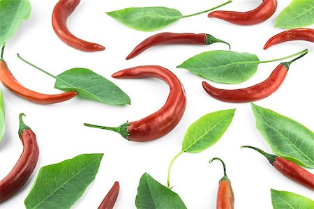 simsearch:628-02228100,k - red hot chili pepper with leaves on a white background Stock Photo - Budget Royalty-Free & Subscription, Code: 400-07613509