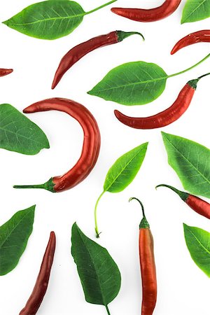simsearch:628-02228100,k - red hot chili pepper with leaves on a white background Stock Photo - Budget Royalty-Free & Subscription, Code: 400-07613597