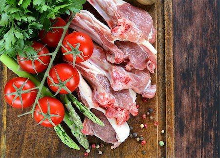 raw meat, lamb chops with vegetables on wooden board Stock Photo - Budget Royalty-Free & Subscription, Code: 400-07625479