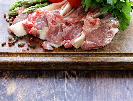 raw meat, lamb chops with vegetables on wooden board Stock Photo - Budget Royalty-Free & Subscription, Code: 400-07625487