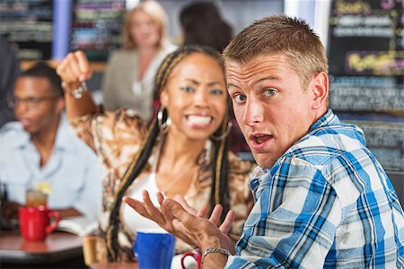 simsearch:400-06396543,k - Angry young woman threatening rude man in cafe Stock Photo - Budget Royalty-Free & Subscription, Code: 400-07620061