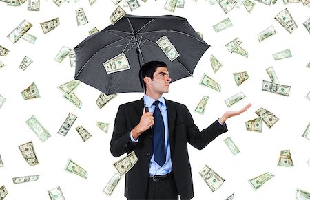 Stock image of businessman with umbrella and falling money Stock Photo - Budget Royalty-Free & Subscription, Code: 400-07620992