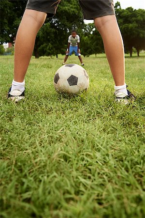 Children playing soccer game in park, with copy space on grass and focus on football ball Stock Photo - Budget Royalty-Free & Subscription, Code: 400-07630749