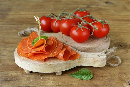 simsearch:400-06207145,k - tasty spicy pepperoni sausage on a wooden board Stock Photo - Budget Royalty-Free & Subscription, Code: 400-07633490