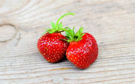 juicy fresh ripe red strawberries on an old wooden textured table top Stock Photo - Budget Royalty-Free & Subscription, Code: 400-07658289