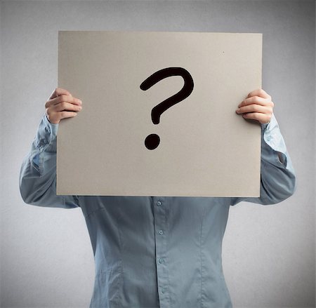 question mark symbol - Man holding a cardboard with a question mark Stock Photo - Budget Royalty-Free & Subscription, Code: 400-07658530