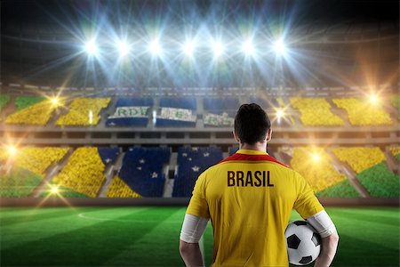 football stadium full crowd pictures - Brasil football player holding ball against stadium full of brasil football fans Stock Photo - Budget Royalty-Free & Subscription, Code: 400-07665345