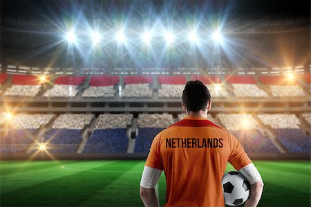 football stadium full crowd pictures - Netherlands football player holding ball against stadium full of netherlands football fans Stock Photo - Budget Royalty-Free & Subscription, Code: 400-07665361