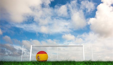 spain soccer field - Football in spain colours against green grass under dark blue and orange sky Stock Photo - Budget Royalty-Free & Subscription, Code: 400-07665886