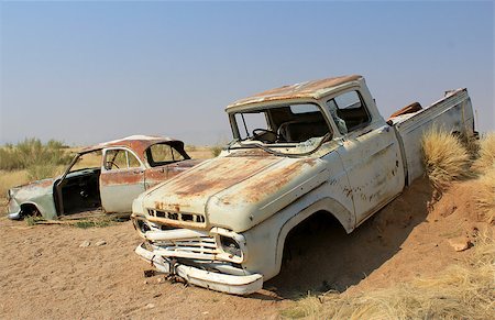 Old and rusty car wreck at the last gaz station before the Namib desert. Solitaire, Namibia. Stock Photo - Budget Royalty-Free & Subscription, Code: 400-07666396