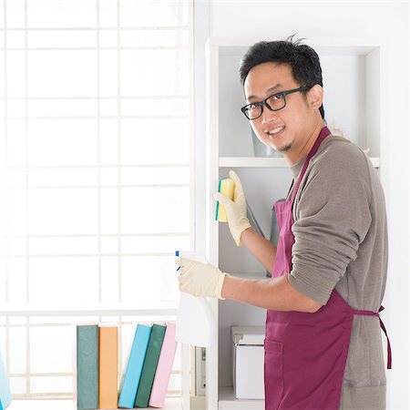 simsearch:400-08693600,k - Asian man housekeeping. House husband doing house chores, with home interiors. Stock Photo - Budget Royalty-Free & Subscription, Code: 400-07667621