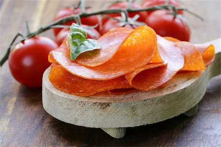 simsearch:400-06207145,k - tasty spicy pepperoni sausage on a wooden board Stock Photo - Budget Royalty-Free & Subscription, Code: 400-07662167