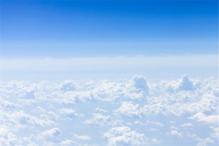 Blue sky with clouds background with copy space. View from airplane Stock Photo - Budget Royalty-Free & Subscription, Code: 400-07662759