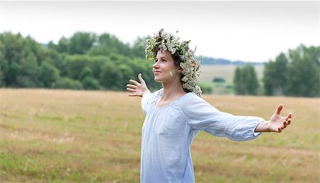 portrait of a young woman wearing a crown of summer wildflowers Stock Photo - Budget Royalty-Free & Subscription, Code: 400-07679305