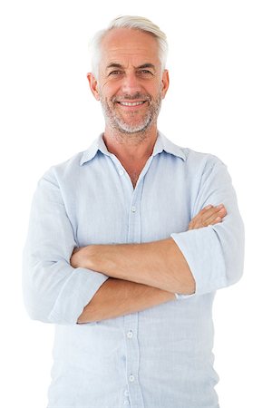 Smiling man posing with arms crossed on white background Stock Photo - Budget Royalty-Free & Subscription, Code: 400-07686081