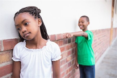 Pupil bullying another in the hall at the elementary school Stock Photo - Budget Royalty-Free & Subscription, Code: 400-07689061