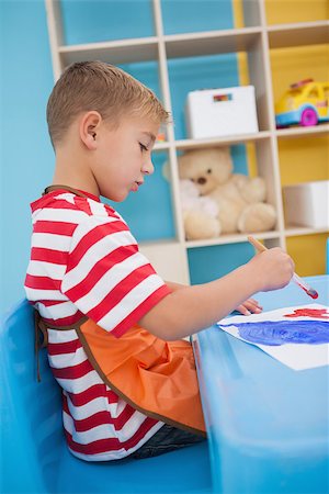 Cute little boys painting at table in classroom at the nursery school Stock Photo - Budget Royalty-Free & Subscription, Code: 400-07689158