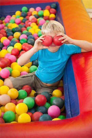 Happy boy playing in ball pool at a party Stock Photo - Budget Royalty-Free & Subscription, Code: 400-07689265