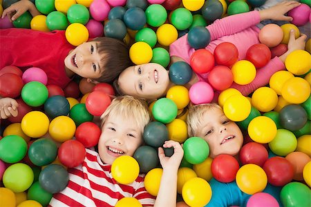 Happy children playing in ball pool at a party Stock Photo - Budget Royalty-Free & Subscription, Code: 400-07689262
