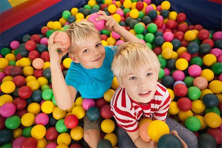 Happy children playing in ball pool at a party Stock Photo - Budget Royalty-Free & Subscription, Code: 400-07689270