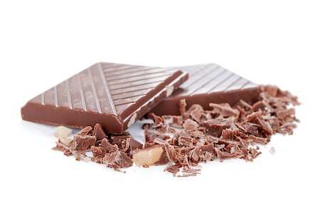 Chopped chocolate bars isolated on white background Foto de stock - Super Valor sin royalties y Suscripción, Código: 400-07681365