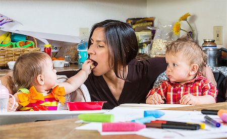 A Baby feeds her mother at breakfast Stock Photo - Budget Royalty-Free & Subscription, Code: 400-07682077